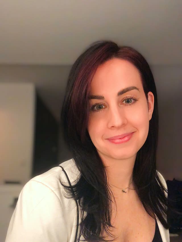 Elizabeth Wendel, smiling, with long dark hair